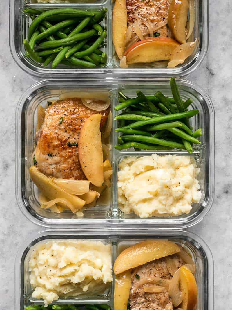 Three Apple Spice Pork Chop meal prep containers in a row