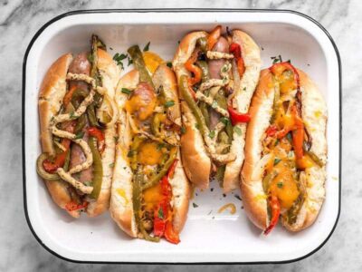 You don't need a grill to make these sweet and tangy Roasted Bratwurst with Peppers and Onions because the oven does all the work. BudgetBytes.com