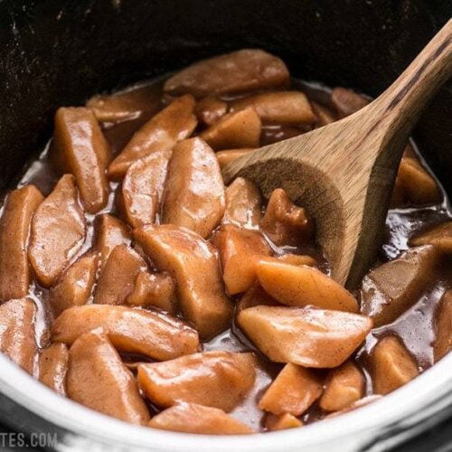 Slow Cooker Hot Buttered Apples are an easy and versatile dessert that is perfect for using up your glut of autumn apples! BudgetBytes.com