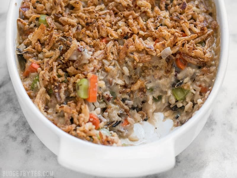 Plenty of vegetables, a hearty wild rice blend, and a super creamy sauce make this Wild Rice and Vegetable Casserole a warm comforting dish for winter! BudgetBytes.com Wild Rice and Vegetable Casserole freshly baked in a casserole dish