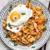 This Kimchi Fried rice is tangy, spicy, and the perfect way to use up all the leftover ingredients and scraps in your kitchen. BudgetBytes.com