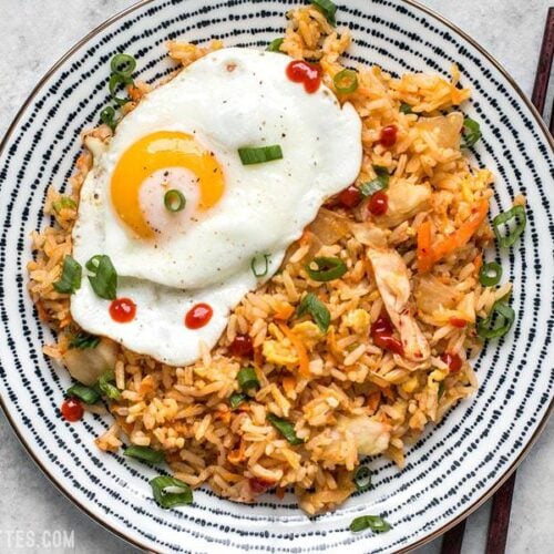 This Kimchi Fried rice is tangy, spicy, and the perfect way to use up all the leftover ingredients and scraps in your kitchen. BudgetBytes.com