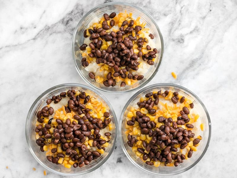 Add seasoned black beans to bowls