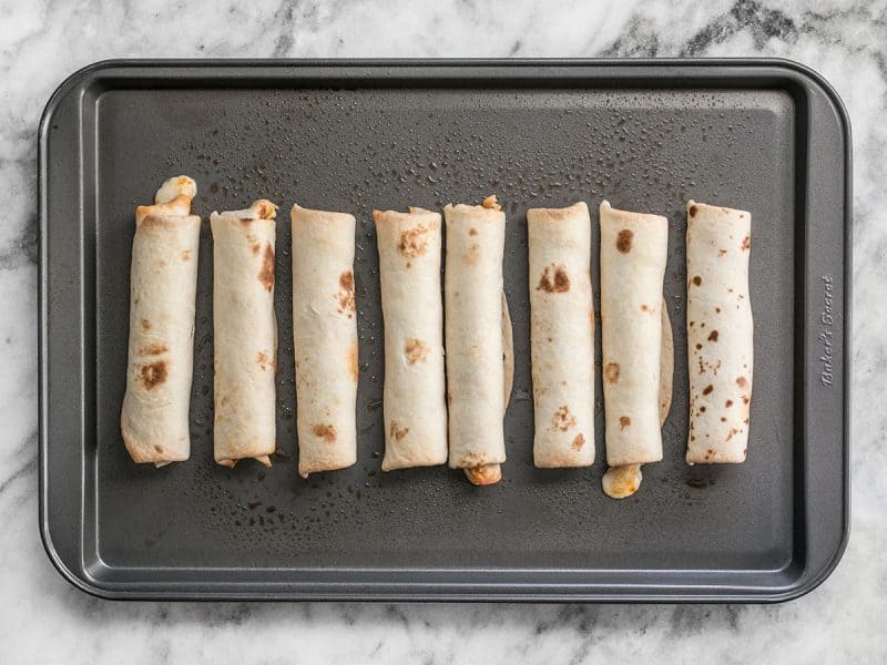 Baked Pizza Roll Ups on a baking sheet