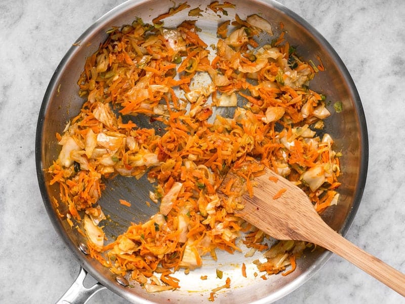 Add kimchi to the skillet