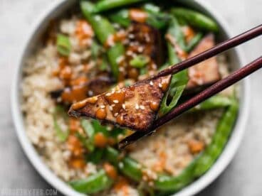 These vegan Soy Marinated Tofu Bowls are full of rich flavors and plenty of texture to keep your taste buds happy and your belly full. BudgetBytes.com