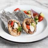 Prep the ingredients for these Greek Chicken Wraps to keep on hand to build fresh wraps or salads all week. BudgetBytes.com