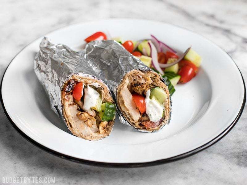 Prep the ingredients for these Greek Chicken Wraps to keep on hand to build fresh wraps or salads all week. BudgetBytes.com