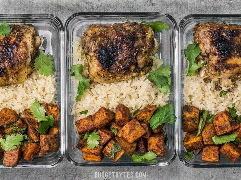 Three Pressure Cooker Chicken and Rice Meal Prep containers in a row