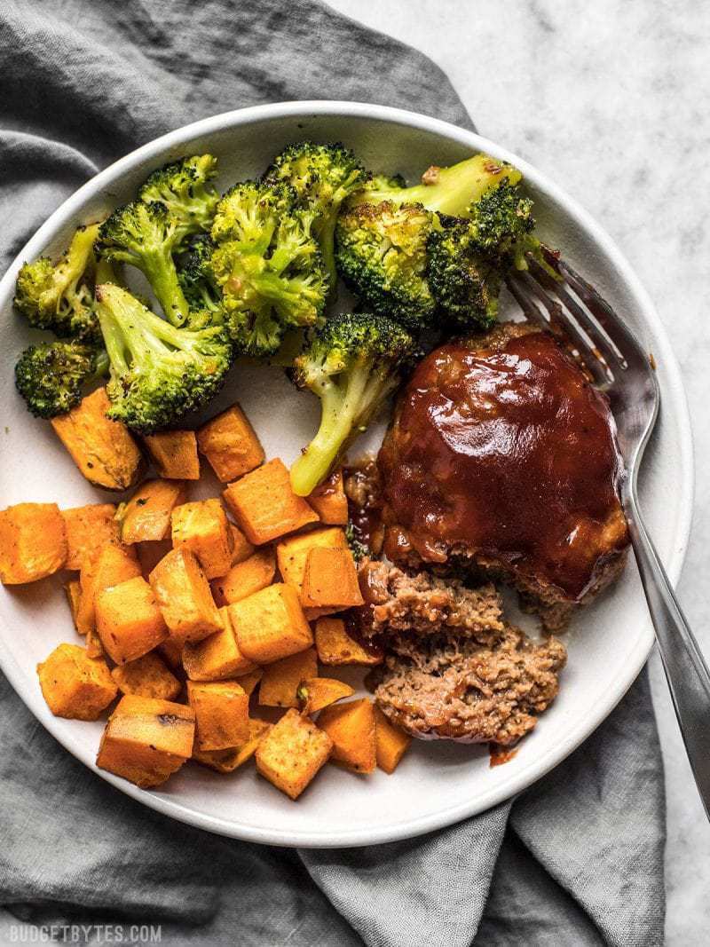 Sheet Pan BBQ Meatloaf Dinner is an easy weeknight dinner for two made with just one sheet pan with very little effort or clean up. Budgetbytes.com Sheet Pan BBQ Meatloaf Dinner plated up and ready to serve