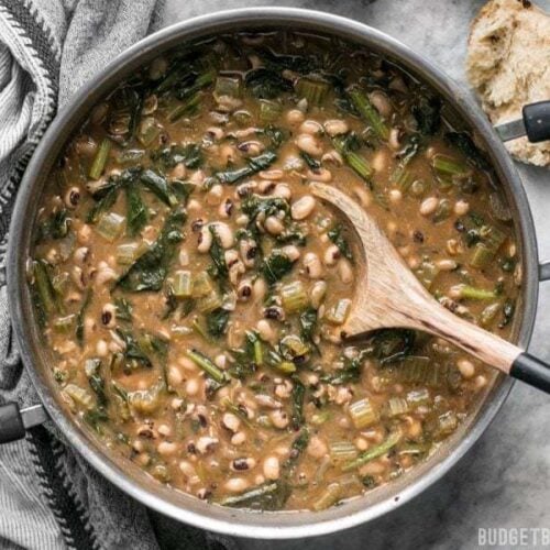 Slow Simmered Black Eyed Peas and Greens is a great cold weather comfort food that is as healthy as it is delicious! BudgetBytes.com