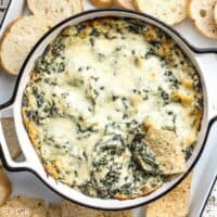 Double Spinach Artichoke Dip is PACKED with spinach, three types of cheese, and just enough spice to tingle your taste buds. BudgetBytes.com