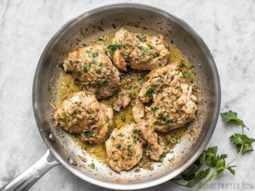 A quick and buttery herb pan sauce transforms these simple chicken thighs into decadent Herb Butter Chicken Thighs. BudgetBytes.com