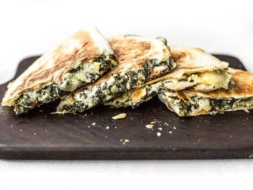 Use your leftover party dips to make a delicious lunch the next day, like these super creamy Spinach Artichoke Quesadillas. BudgetBytes.com