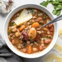 A variety of colors, fresh vegetables, and vibrant herbs and spices make this Vegetarian 15 Bean Soup flavorful, filling, AND incredibly good for you. BudgetBytes.com