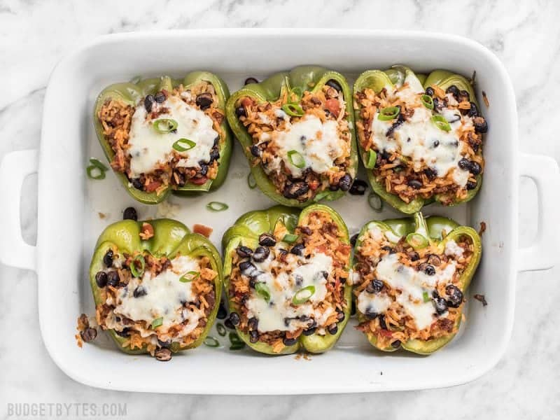 Top view of a casserole dish with six Chorizo Stuffed Bell Peppers