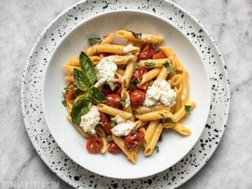 It only takes a few fresh ingredients make this Fresh Tomato Basil Pasta with Ricotta, the perfect light lunch or dinner for summer! BudgetBytes.com