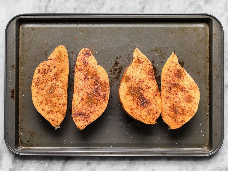 Season Sweet Potatoes on baking sheet