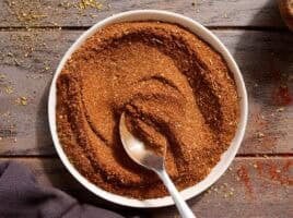 Homemade taco seasoning in a bowl with a spoon.