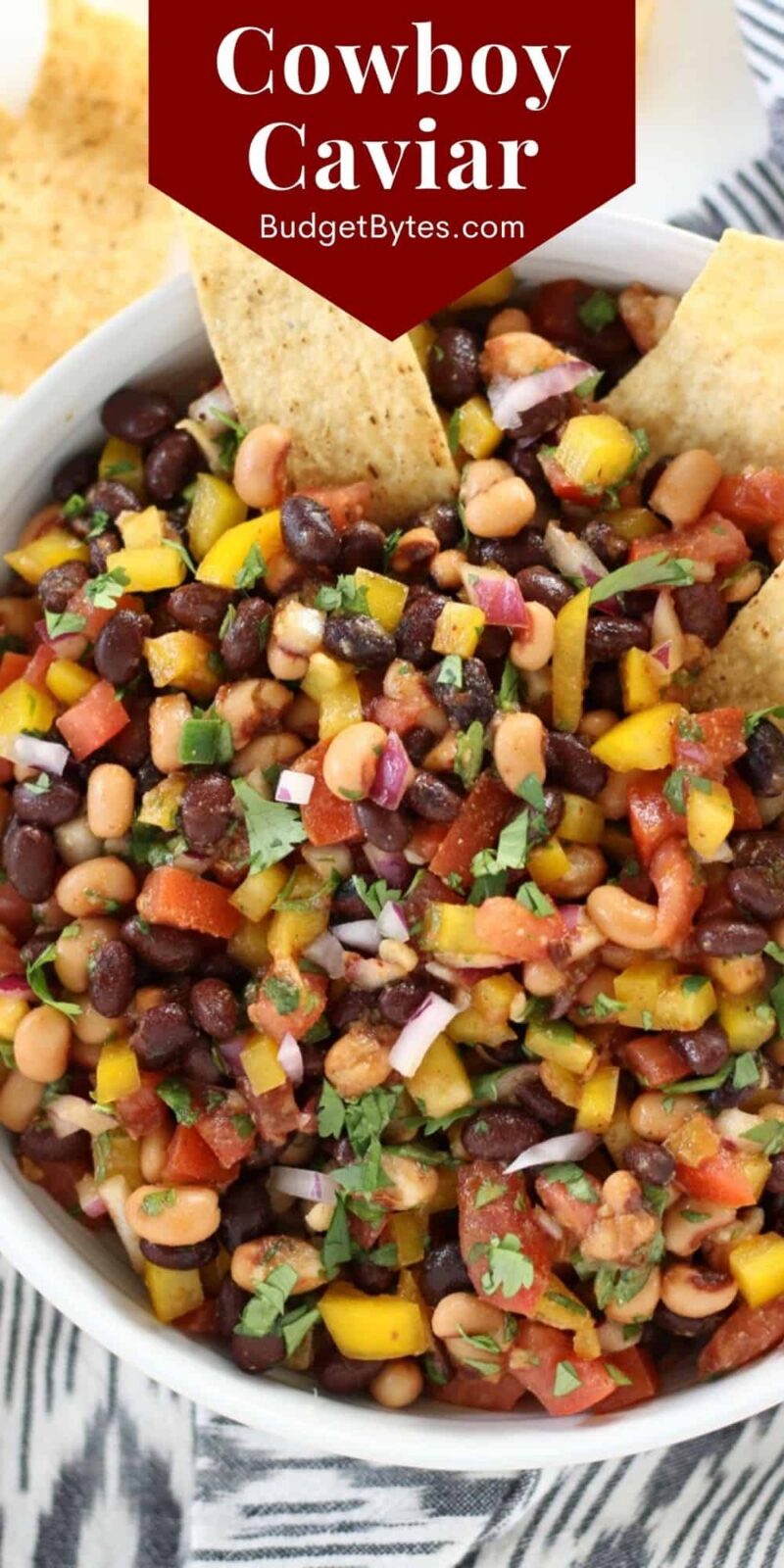 close up image of cowboy caviar with chips in the side, title text at the top