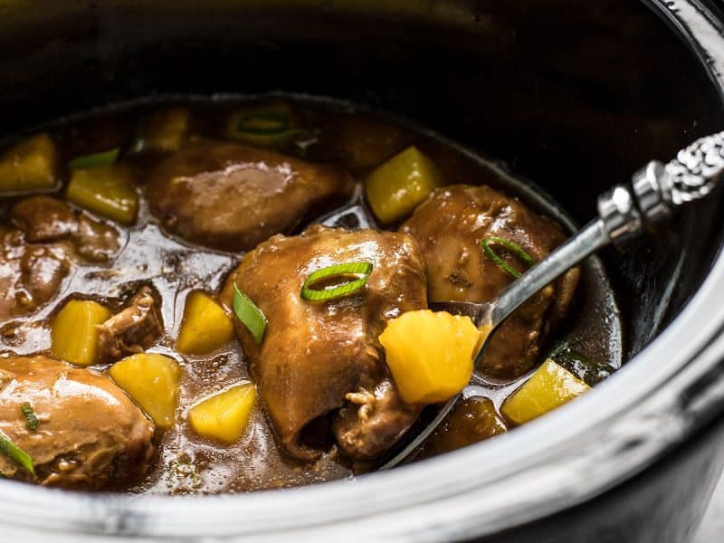 Close side view of Slow Cooker Pineapple Teriyaki Chicken in the slow cooker