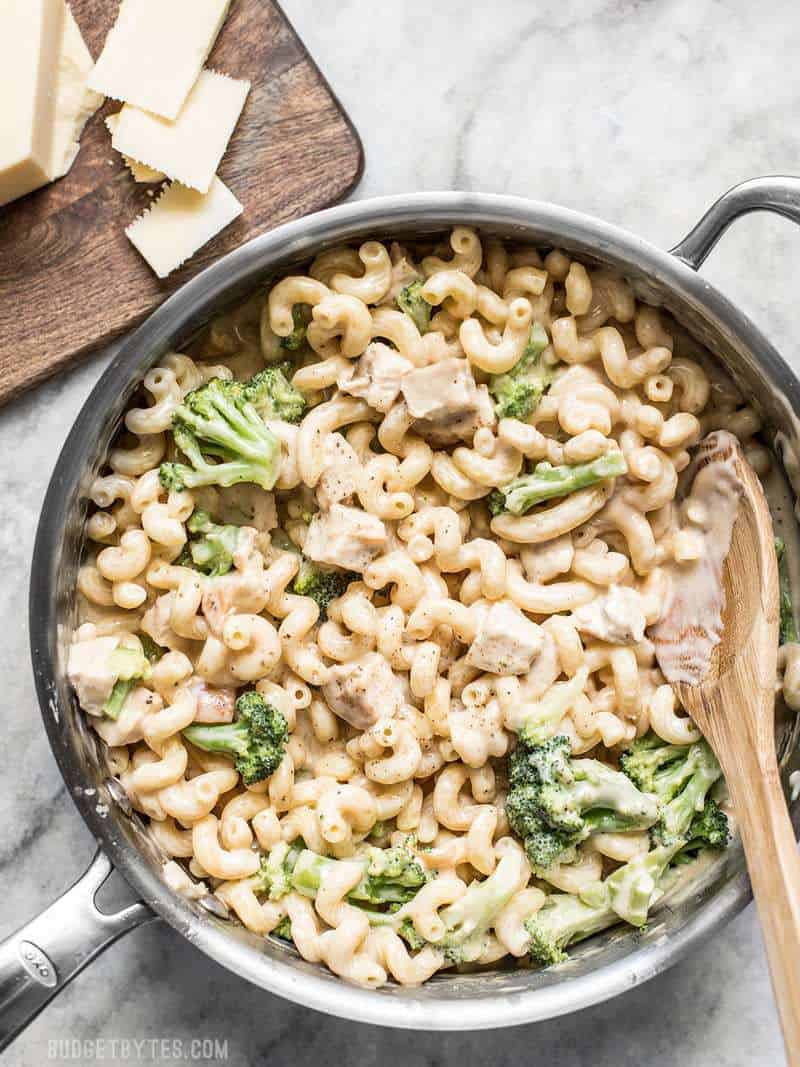 A pan full of White Cheddar Mac and Cheese with broccoli