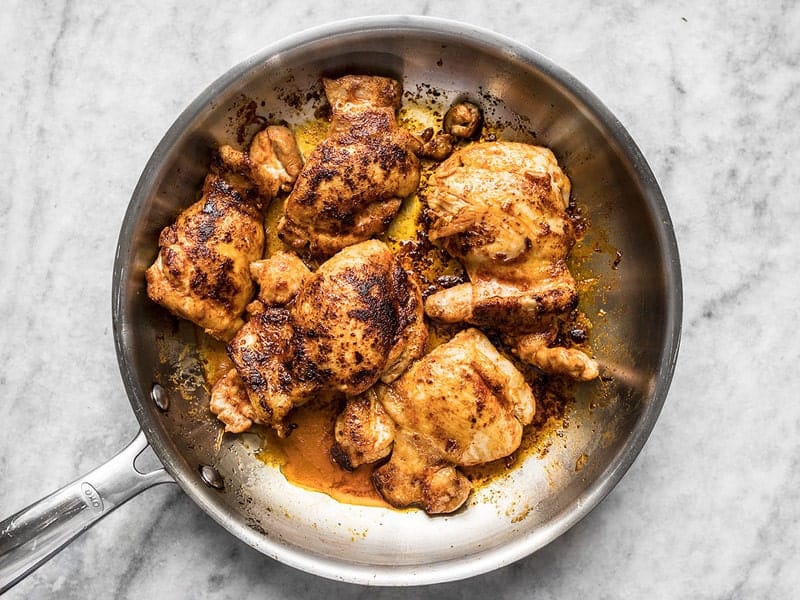 Browned Chicken Thighs in a skillet