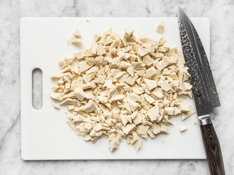 chopped tofu on a cutting board