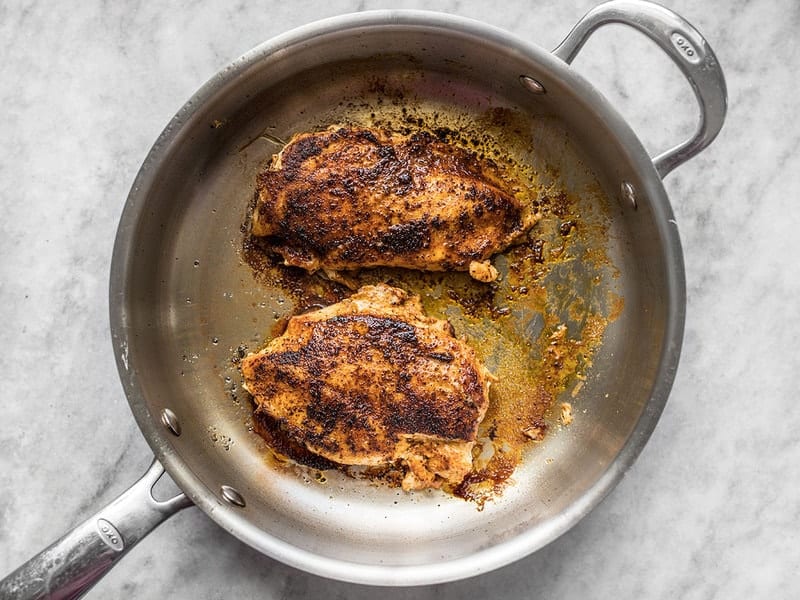 Sear chicken breast in skillet