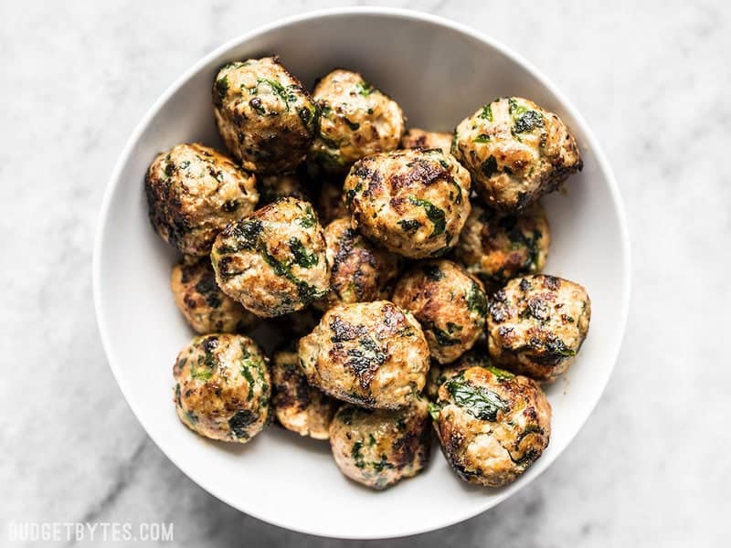 A bowl full of cooked Spinach and Feta Turkey Meatballs