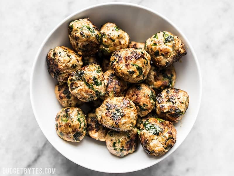 Spinach and Feta Turkey Meatballs are an easy way to add flavor and protein to your meal using inexpensive ground turkey. Perfect for meal prep! Budgetbytes.com