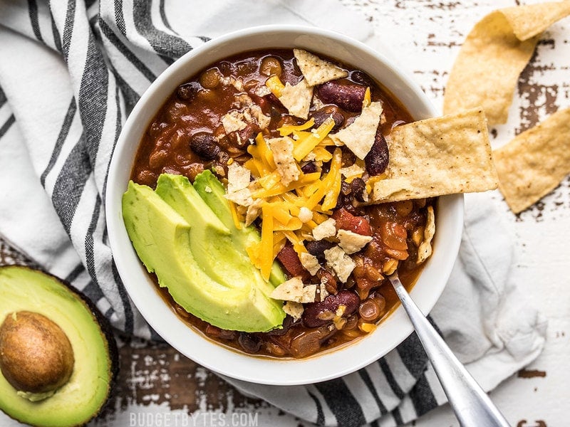 This Slow Cooker Vegetarian Lentil Chili makes a huge batch, is packed with flavor and nutrients, and can be made for only about 5 dollars! Budgetbytes.com