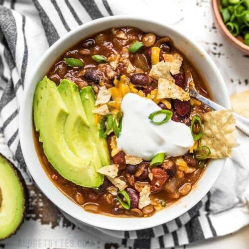 This Slow Cooker Vegetarian Lentil Chili makes a huge batch, is packed with flavor and nutrients, and can be made for only about 5 dollars! Budgetbytes.com