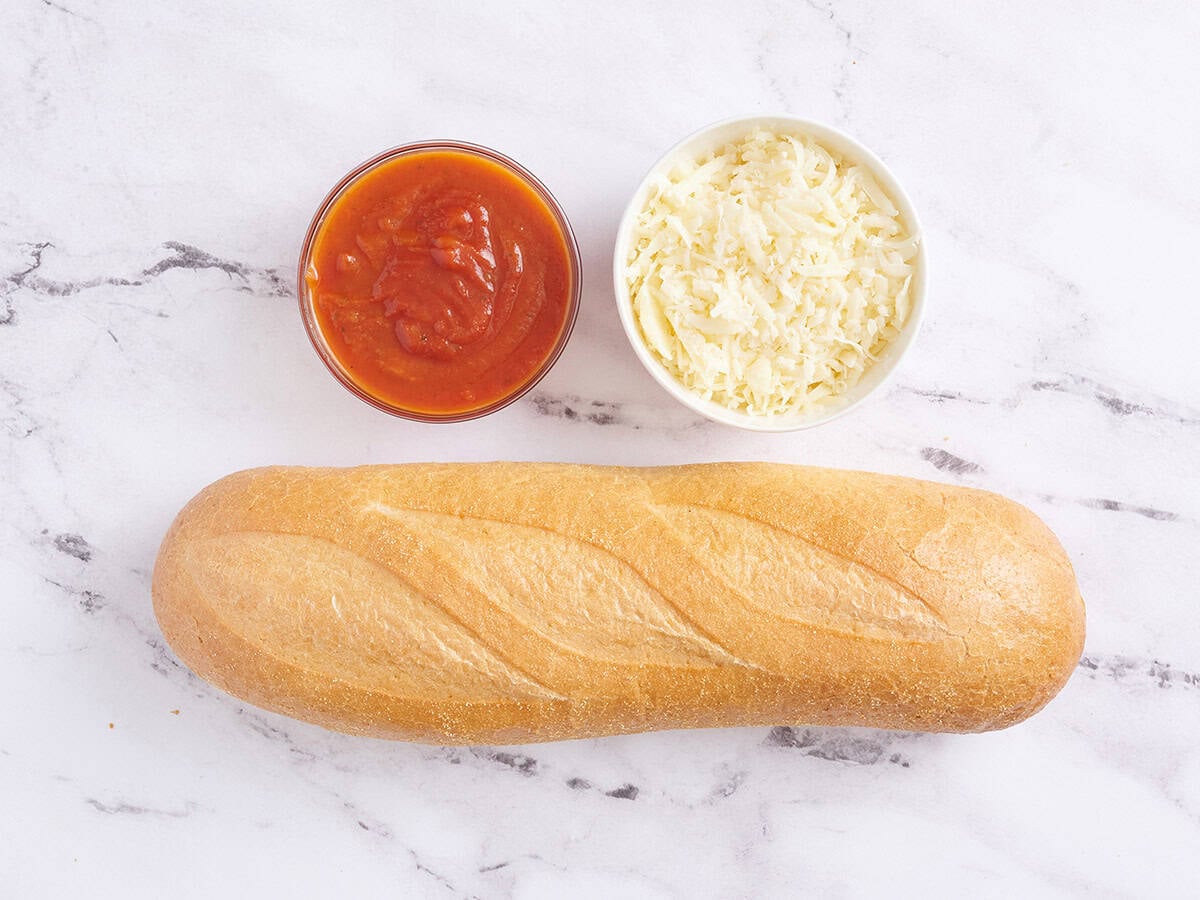 The ingredients to make French bread pizzas.