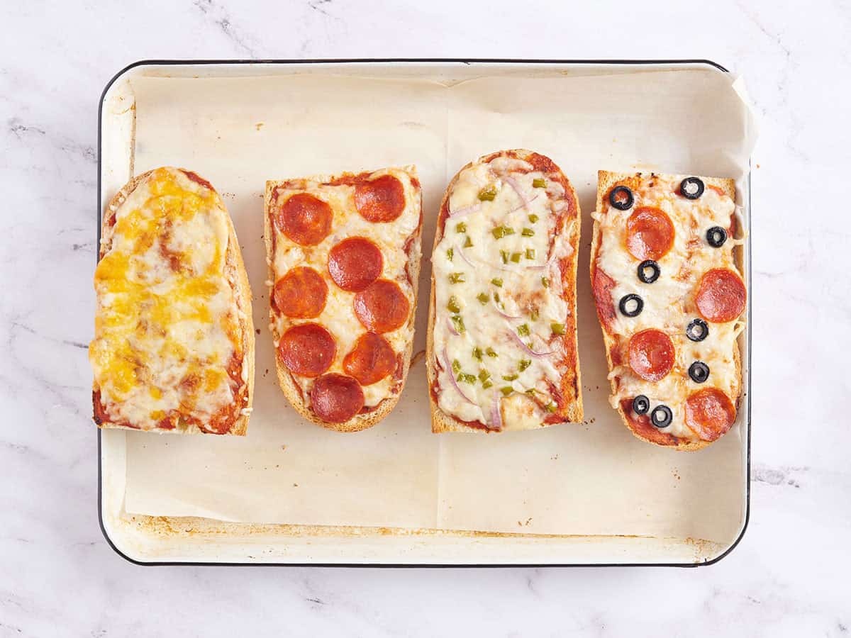 Fast French bread pizzas after baking on a baking tray.