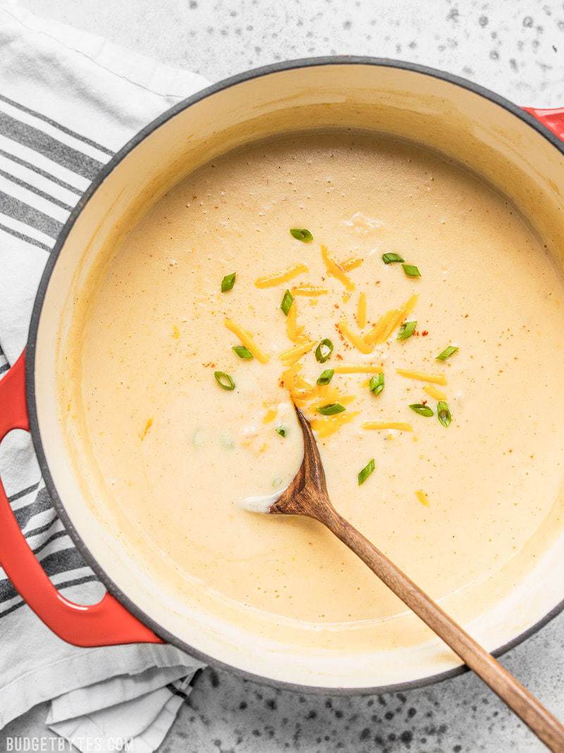 Cheesy Cauliflower and Potato Soup is rich and creamy without being overly heavy. Eat your vegetables and enjoy them, too! Budgetbytes.com