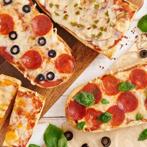 Overhead view of homemade French bread pizzas.