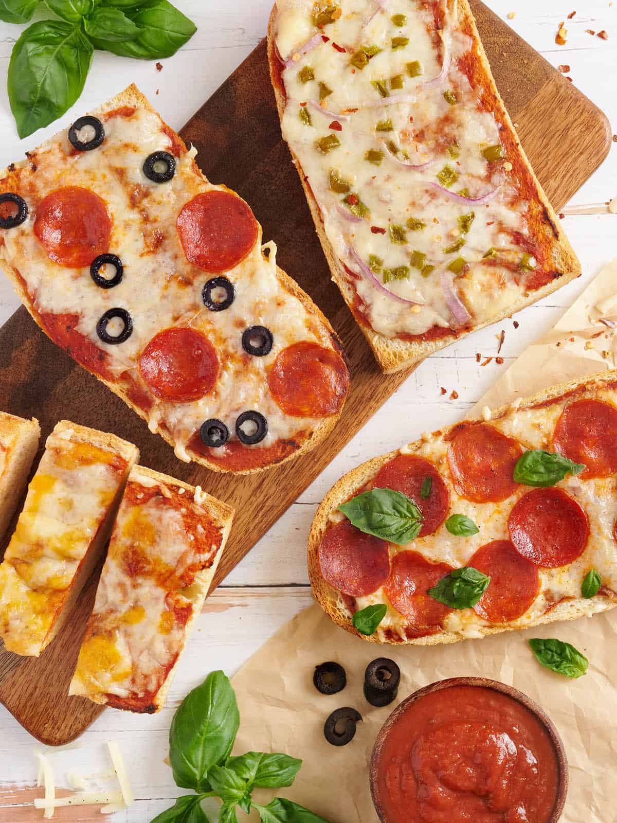 Overhead view of homemade French bread pizzas.