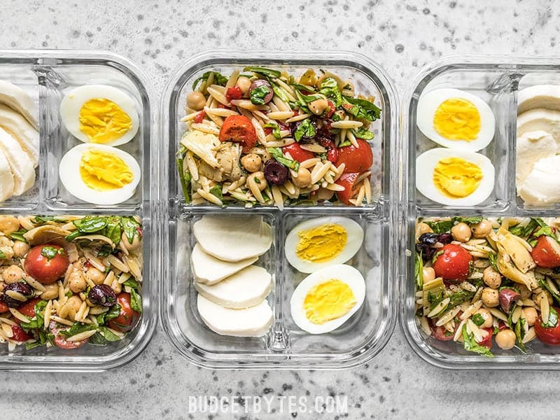 Line up of Orzo Salad Meal Prep Lunch Boxes