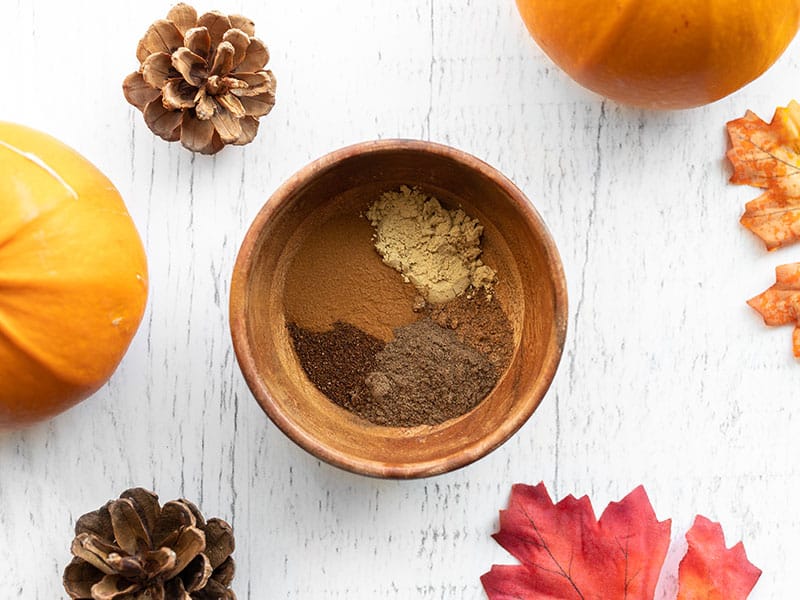 Overhead view of a small wooden bowl with spices