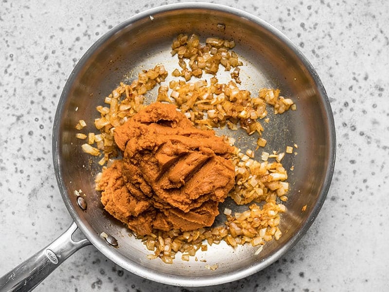 Add Pumpkin Purée to onions in the skillet