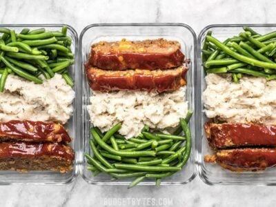 This Cheeseburger Meatloaf Meal Prep is an easy American classic meal that you'll look forward to each day. Toss the TV dinners and make your own! Budgetbytes.com