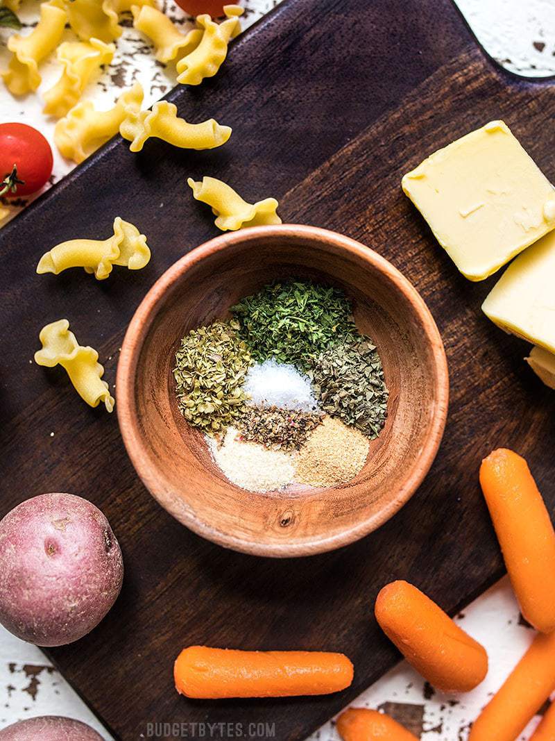 All-Purpose Garlic Herb Seasoning ingredients with vegetables, pasta, and butter