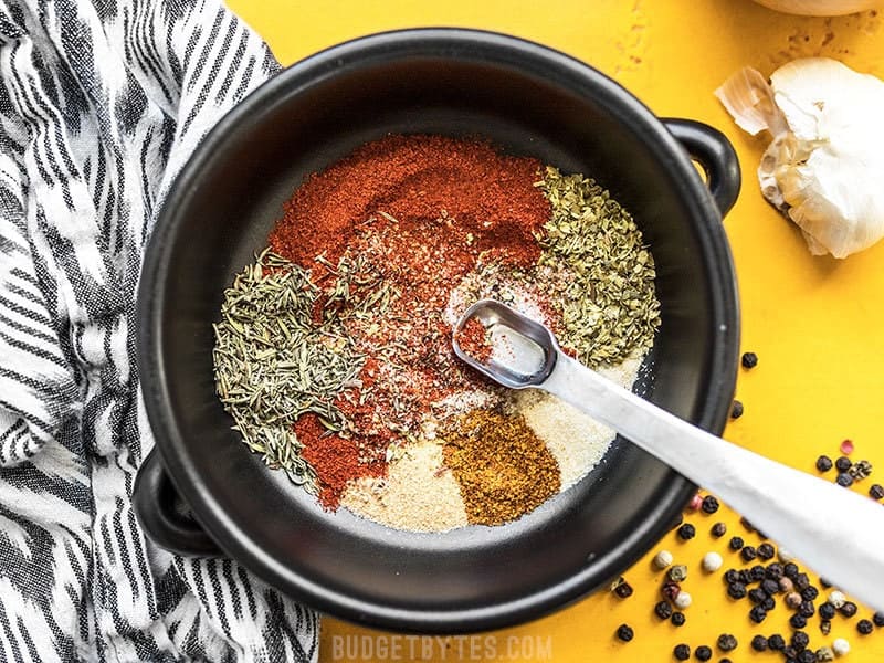 Stirring together herbs and spices for Homemade Cajun Seasoning