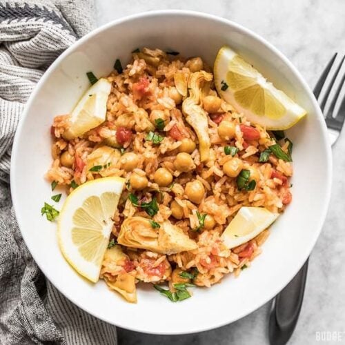 A hearty bowl of Rice Cooker Spanish Chickpeas and Rice with fresh lemon and parsley