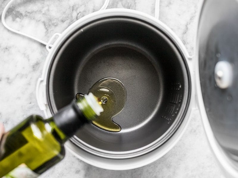 Add Oil and Beef to Rice Cooker