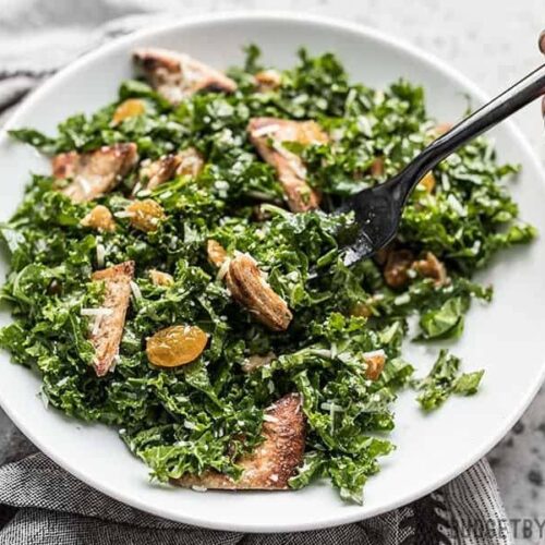 Kale and Toasted Pita Salad with Parmesan in the process of being eaten.