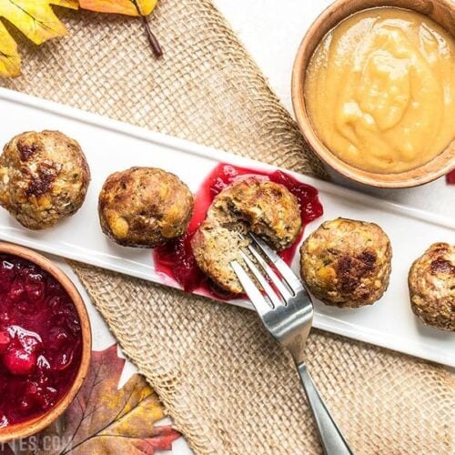 Turkey and Stuffing Meatballs dipped in cranberry sauce and gravy.
