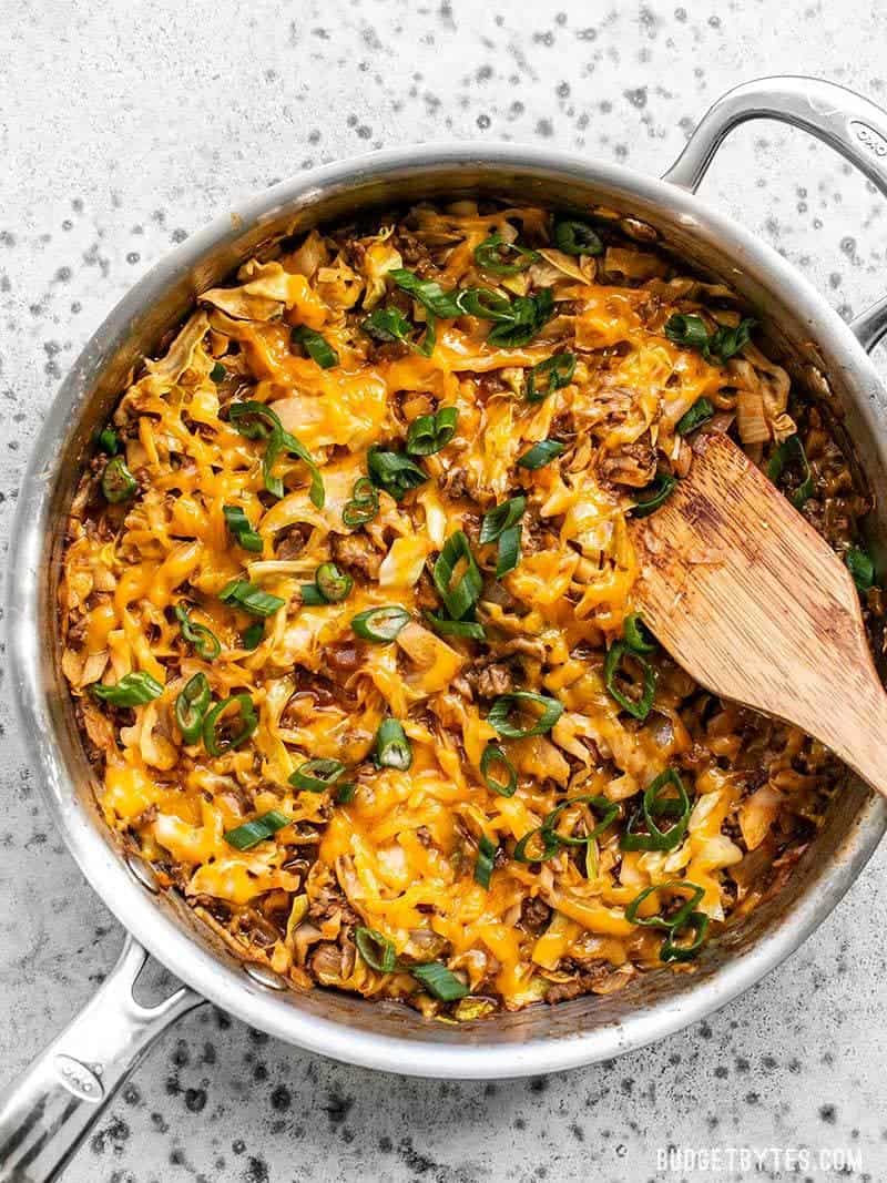 This quick BBQ Beef and Cabbage comes together in one skillet and uses inexpensive cabbage to bulk out the meal instead of relying on pasta or rice. Budgetbytes.com A skillet full of BBQ Beef and Cabbage ready to eat.