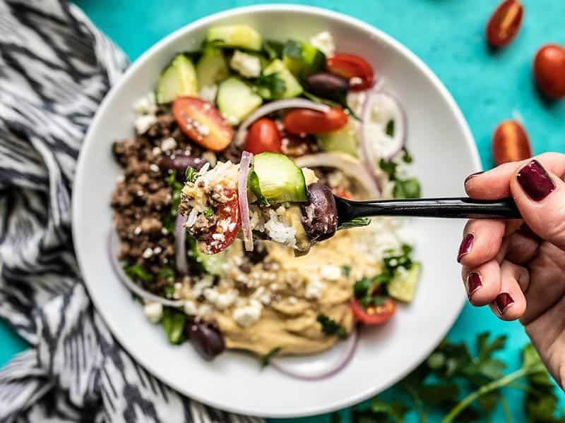 A fork full of Mediterranean Hummus Bowls